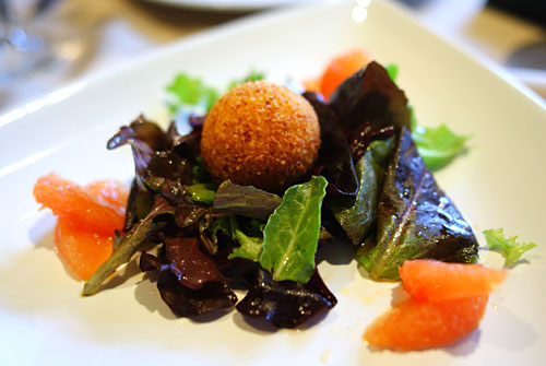 Panko Crusted Goat Cheese, on a bed of Organic Mixed Greens with a Red Grapefruit Vinaigrette