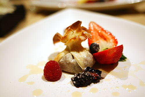 Pear and Walnut Phyllo Dough Purse drizzled with Pear, Vin Santo Syrup and dusted with Powdered Sugar