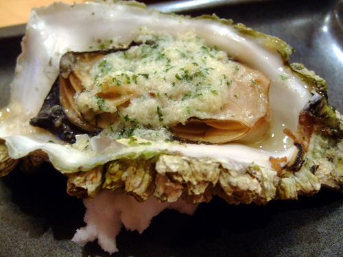 Charcoal Grilled Oysters topped with Garlic Butter