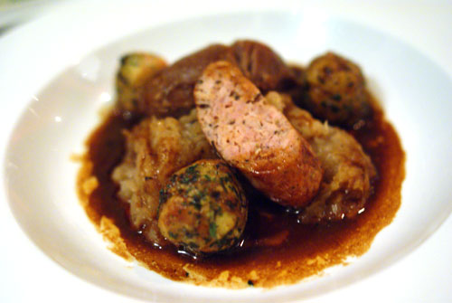 Braised Pork Cheek and Caraway Sausage with Sauerkraut, Pretzel Dumplings and Beer Sauce