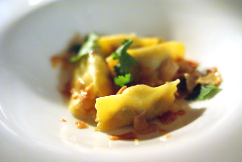 Duck confit agnolotti, shaved foie gras, duck consomme