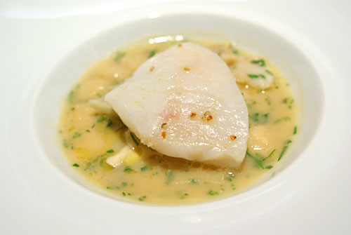 John Dory fillet, poached in Malabar black pepper-citrus butter, cannelloni beans, marin velouté, crunchy sauce