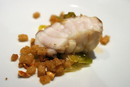 monkfish. chicken skin. chicken tail. leek. onion. fennel chew. fennel pollen. sourdough. hazelnut.