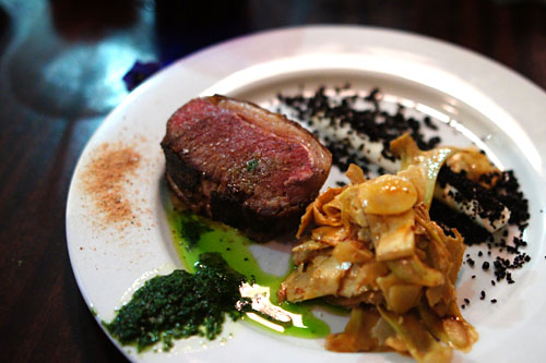 Roasted Sonoma Saddle of Lamb, Goat Cheese, Candied Black Olive, Artichoke Salad, Mint Pesto