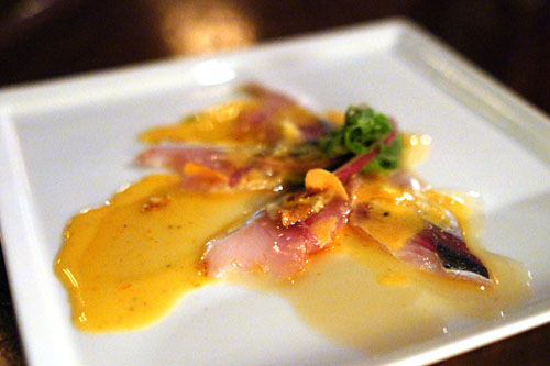 Tiradito de jurel, Japanese aji carpaccio, garlic, ginger lemon sauce