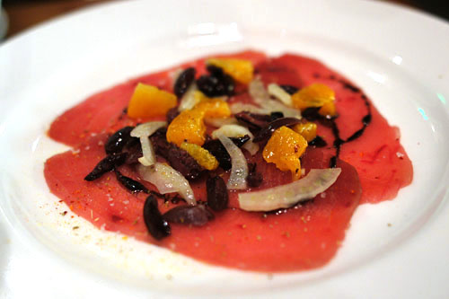 Ahi Tuna 'crudo' with black olive, fennel pollen, orange powder, chili