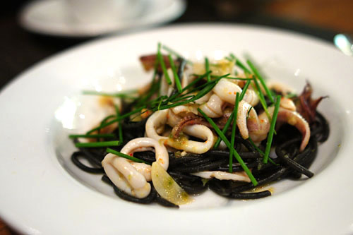 Seared Monterey calamari with squid ink linguini, jalapeno pesto, extra virgin olive oil