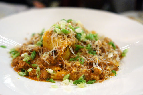 Hand cut maltagliati, pork ragù, scallion, Gruyère