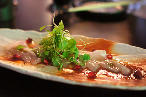 White fish sashimi with pomegranate