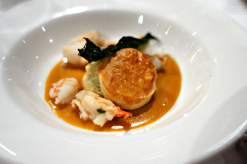 Lobster with biscuits, shellfish gravy, and fried kale