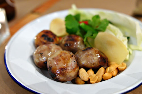 Sai krok Isaan / sour Isaan sausage, grilled fermented pork sausage, w/ bird eye chile, cabbage