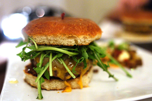 The PALADAR Burger: Angus Beef/ Cheddar Cheese/ Onion Jam/ Remoulade/ Wild Arugula/ Brioche Bun.