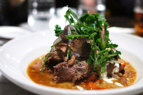 Slow Roasted Leg of Lamb with Cous Cous, Red Pepper, Spiced Yogurt & Herb Salad