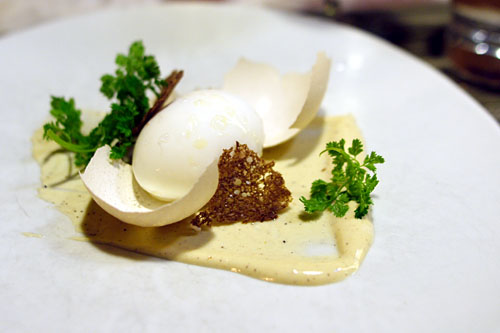 Poached egg in the shell, pumpernickel, caesar dressing, bean sprouts