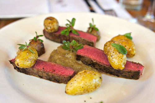 Flat iron steak, crispy pee wee potatoes & shallot/whiskey marmalade