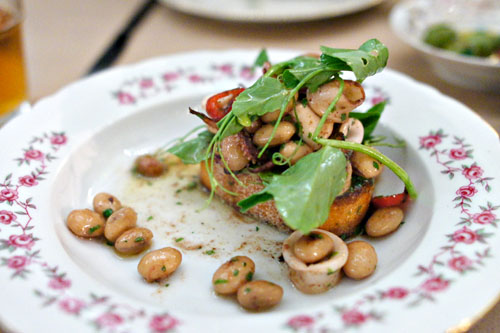 local squid, shelling beans, garlic, pea tendrils, grilled bread