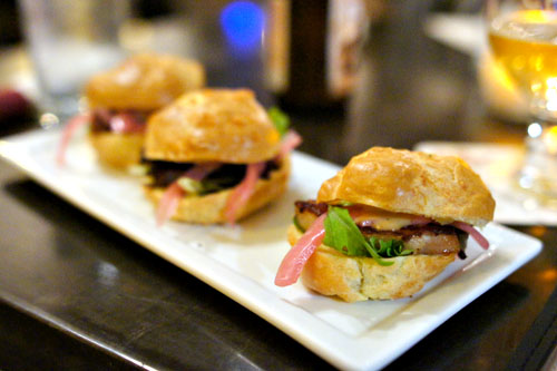 Gougere, sous-vide pork belly, mustard sauce, pickled red onions, mesclun