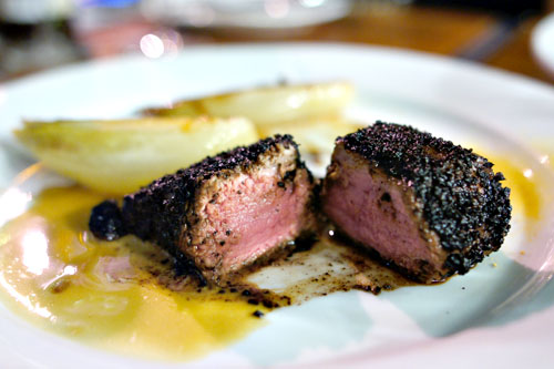 Veal, Black Olive Tapenade Crust, Orange Caramelized Endive, Clementine Beurre Blanc