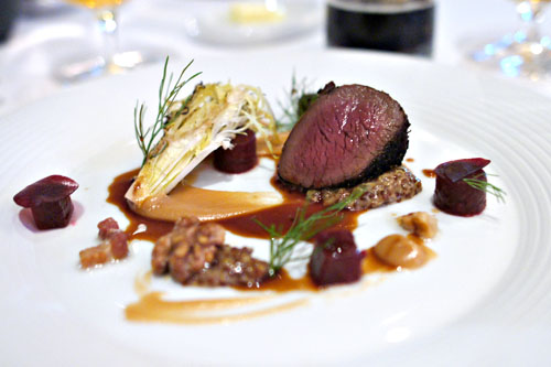 Rosemary-juniper crusted venison with date-tamarind purée, roasted beets, lardons, grilled winter greens and walnuts