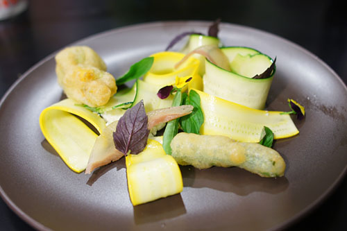 Summer squash and blossom, melted guanciale and herbs
