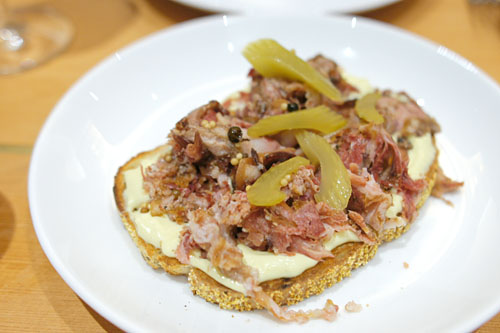 porchetta di testa pastrami on rye with celery pickles