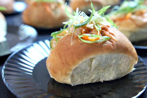 House Made Mini Korean-BBQ Sausage Rolls, Jalapeno Potato Roll, Caramelized Onion, Wasabi Aioli, Kimchi Sauerkraut