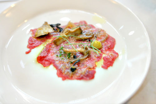 beef carpaccio with mushroom conserva, charred leek, sardo