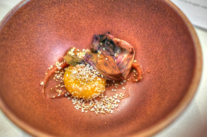 slow cooked egg yolk with sunchoke, date & amaranth