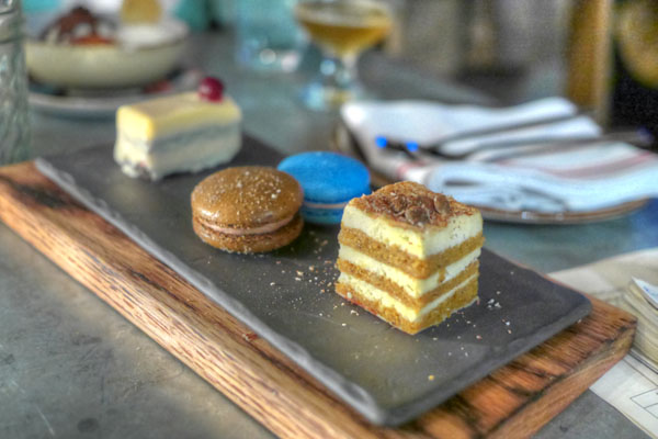 white chocolate tangerine mousse bar / french macaron of the moment / pumpkin spice mascarpone cake