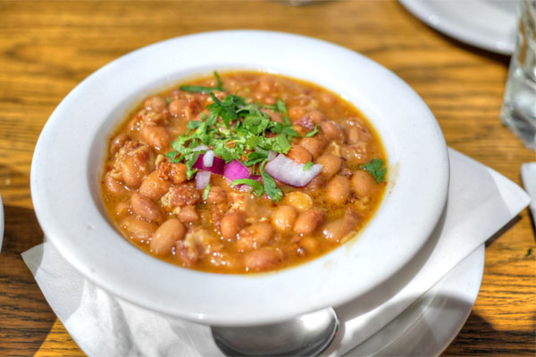 Frijoles charros, pinto beans, bacon chorizo, chile broth