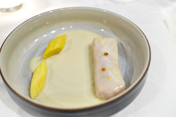 Creamy stew of sturgeon and crab with charred leeks