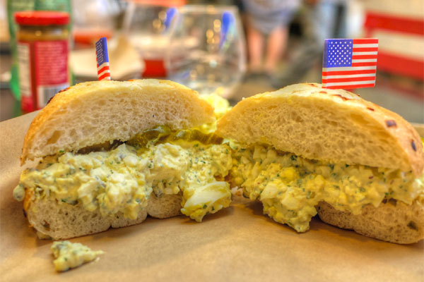 Ruskie, egg salad, pickles, Kaiser roll