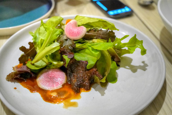 Pecan wood smoked brisket with hoisin, tiny lettuce and root vegetables