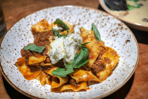 Hand rolled papardelle with lamb bolognese
