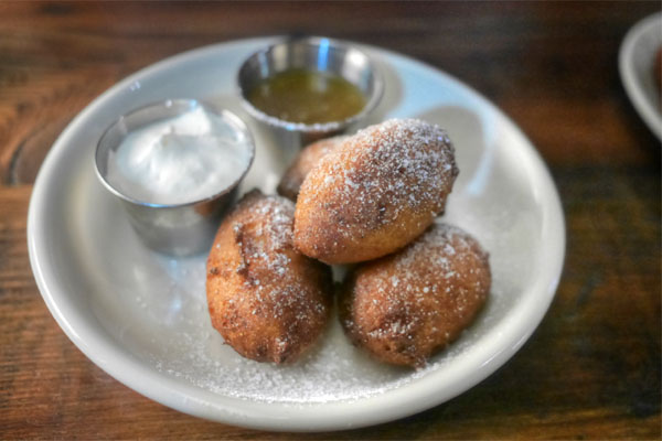 Cornmeal ricotta fritters, salted local honey butter