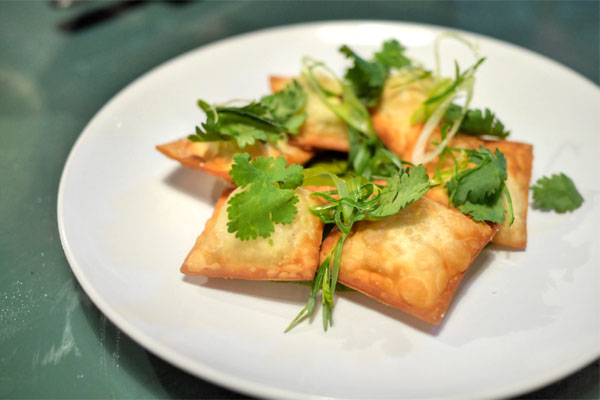 Fried four cheese ravioli / pesto herb salad