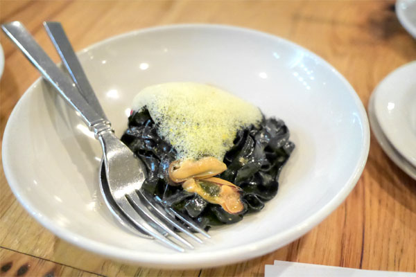 house-made squid ink pasta, mussels, piquillo peppers, saffron