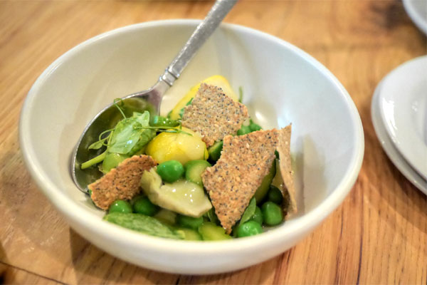 spring vegetables with lemon preserve, seed crackers and vadouvan