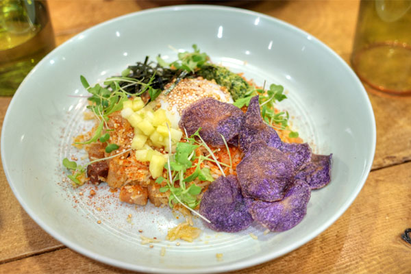 Kimchi fried rice, pineapple fermented kimchi, Amira basmati rice, 63°C sous vide egg, gremolata, pineapple jalapeño salsa, purple potato chip, roasted seaweed, toasted buckwheat & quinoa, and micro greens + slab bacon