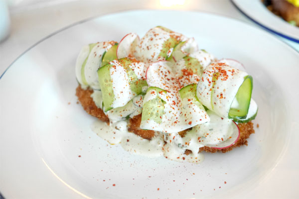 Chicken milanesa, raw and pickled cucumbers, maggi ranch