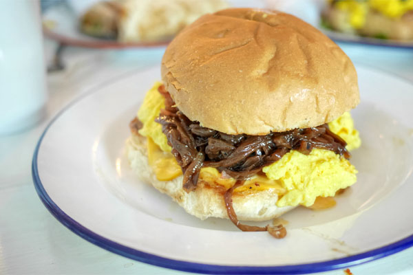 Poached omelette sandwich, caramelized onions, American cheese, jambon de Paris, truffle salt