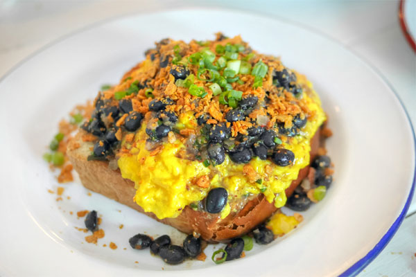 Soft scrambled eggs, black bean salsa, challah, spicy tortilla crumbs