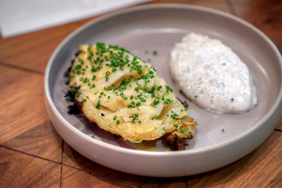 Cabbage Baked in the Embers, Yogurt, Sumac, and Lemon Zest