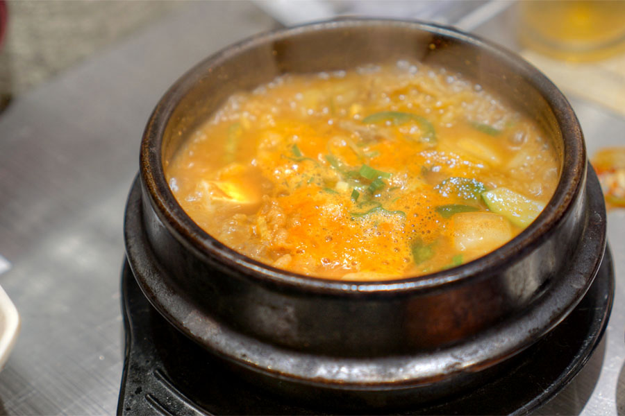 Soybean Paste Stew Made with Anchovy Broth, Fish, Clams, Summer Squash and Beef Brisket