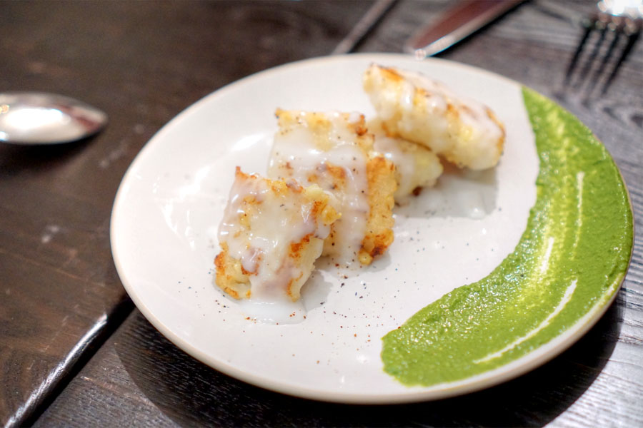 Steamed corn cake with green harissa and coconut