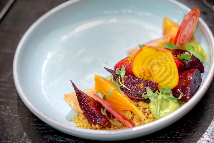 Tiny beets with avocado mousse, curry-almond streusel and cilantro