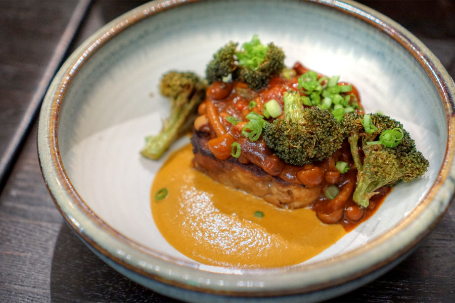 Pretzel bread pudding with mushroom chili, broccoli and spicy squash spread