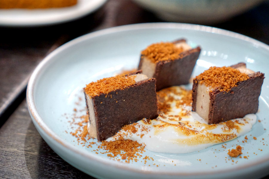 Chocolate cookie and frozen cinnamon custard 'sandwich' with toasted meringue and graham crumble