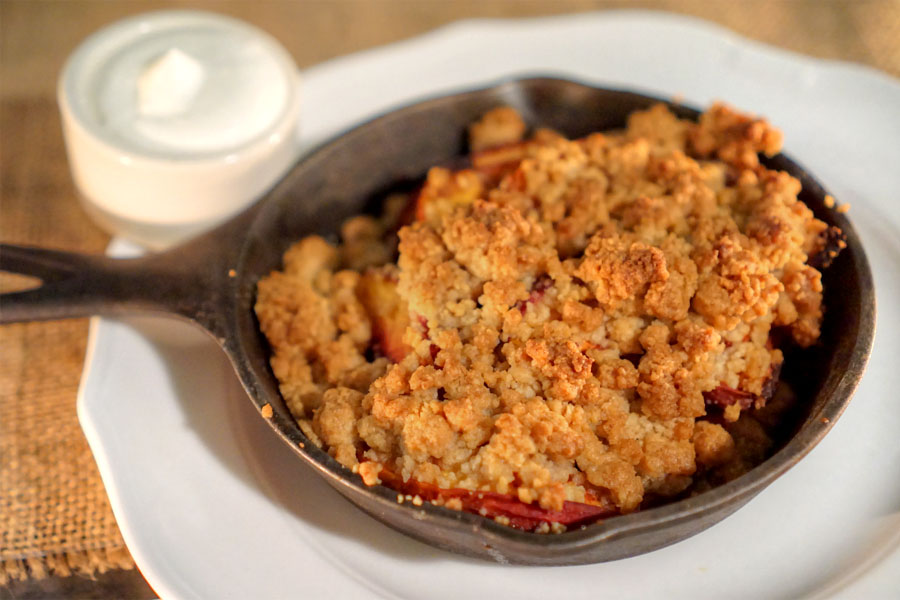 peach crumble with vanilla ice cream