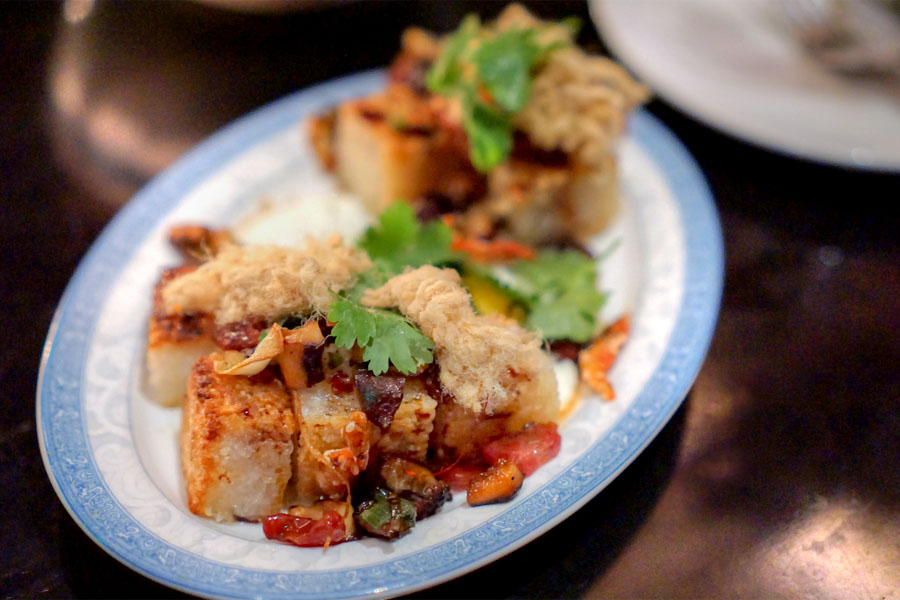 'xio' sticky rice, lap cheung, pork floss, crispy shallots, slow egg, roasted chili vinegar